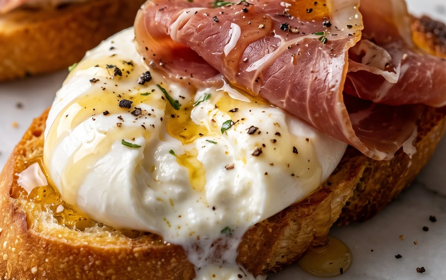 Beef Prosciutto Crostini with Burrata and Lemon Honey Drizzle